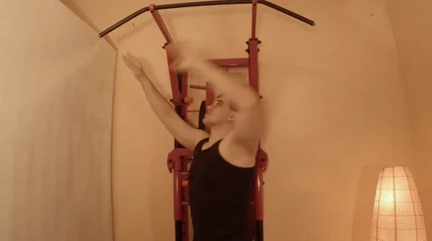 Young Man Pulled on the Bar on the Wall Bars in the Room Stock Footage 62472869