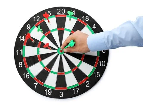 Young man pulling dart out of board on white background, top view Stock Photos