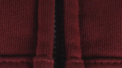 Young Man Pulling Down A Zipper On A Red Shirt Close Up-Shot Stock Footage 36824207