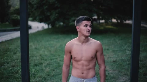 Young man pulling up outdoor. Stock Footage 67188143