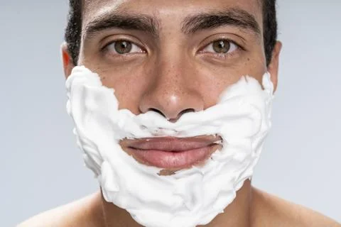 Young man pulling together before his shaving Stock Photos