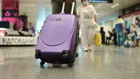 Young man pulling wearing casual style in modern airport terminal Traveler Stock-Footage 172328834