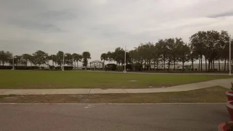 Young man pulling a wheelie on a small motorcycle Stock Footage 259310739