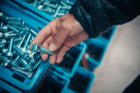 Young man purchasing a hand tool in hardware shop Stock Photos
