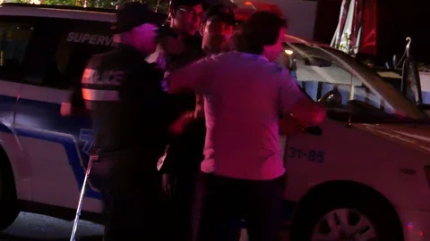 Young man pushing officer Stock Footage 115935316