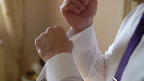 Young man put on cuff links Stock Footage 94035080