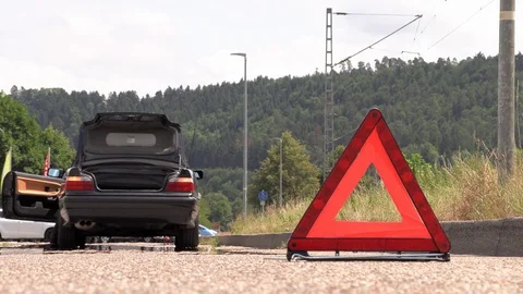 A young man puts an emergency sign Stock Footage 113389336