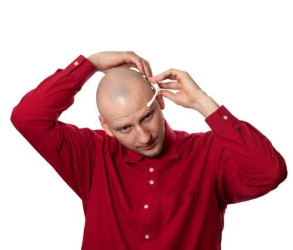 Young man puts on head headset EEG (electroencephalography) Stock Photos