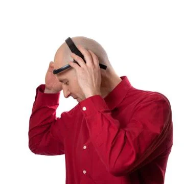 Young man puts on head headset EEG (electroencephalography) Stock Photos
