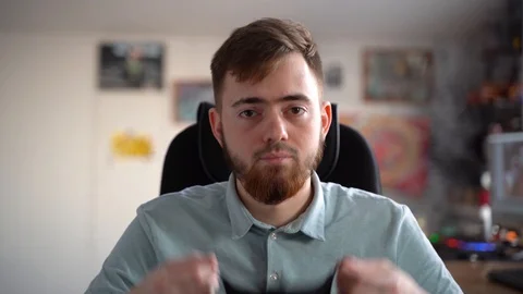 The young man puts on his face a black protective mask 库存影片 127864280