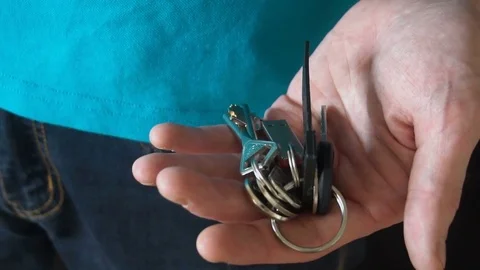 The young man puts the keys in your pocket Video stock 77070135