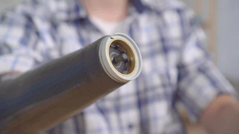 Young man puts on a prosthetic arm close up Stock Footage 119201208