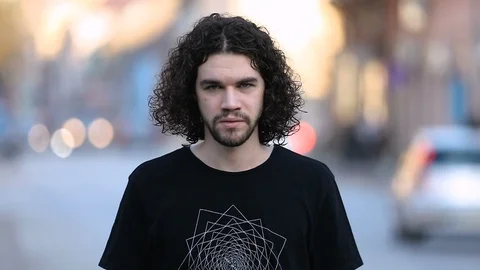 Young man puts protective mask on his face in slow motion Stockbeeldmateriaal 126809310