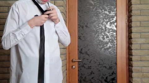 Young man puts on for study. II. Stock Footage 951685