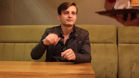 Young  man puts sugar his coffee Stock Footage 83252465