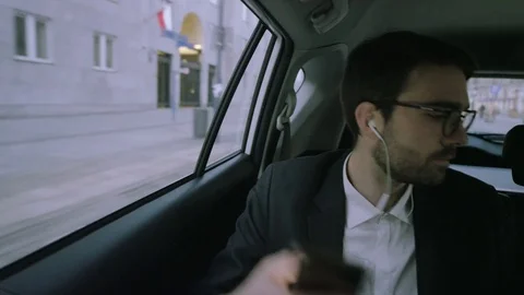 Young Man Putting Off a Mobile and Taking Out a Tablet Stock Footage 73779497
