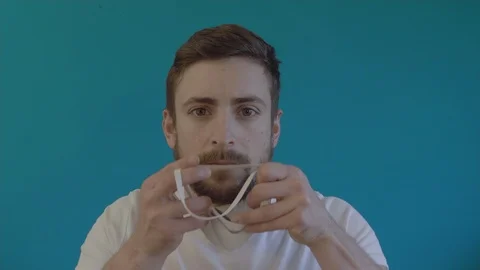 Young Man Putting Protective Mask for Prevention Against Coronavirus Pandemic 3 Vidéo 127028544