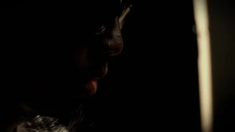 Young man rad Quarn in low light room Stock Footage 289922953