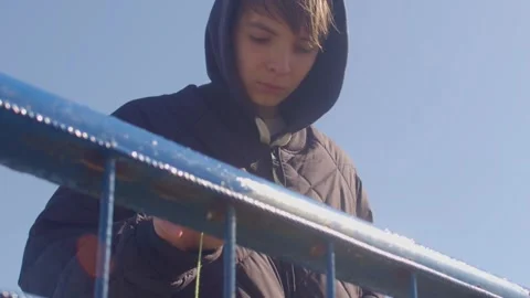 A young man on a railing symbolizes selfdiscovery and urban freedom Stock Footage 313432395