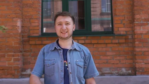 Young man raises his hand, shows a thumb, approving thumb up Stock Footage 138879889