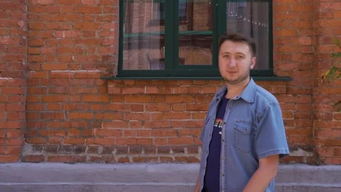 Young man raises his hand, shows a thumb, approving thumb up Stock Footage 139004264