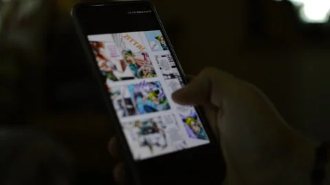 Young man read 2d manga on the phone. manga graphics cartoon Video stock 169500095