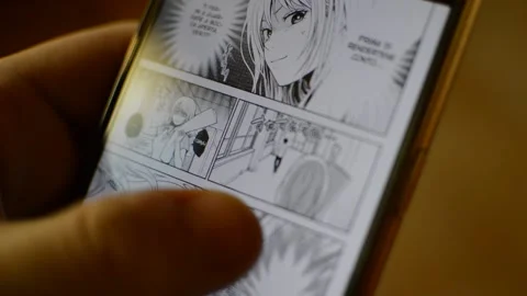 Young man read 2d manga traditional graphic on his phone 스톡 동영상 170049437