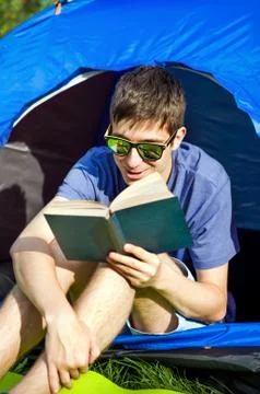 Young Man read a Book Stock Photos