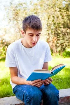 Young Man read a Book Stock Photos