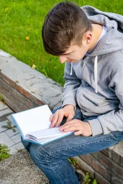 Young Man read a Book Stock Photos