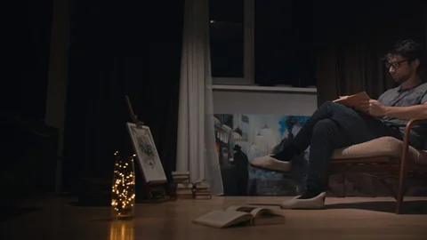 Young man  reading book and getting nervous. Stock Footage 97638434