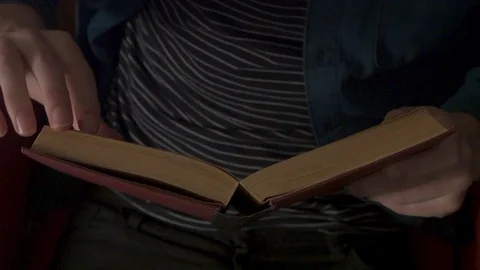 Young man reading book 스톡 동영상 78028086