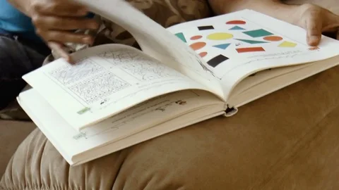 Young man reading a book Stock Footage 78306141