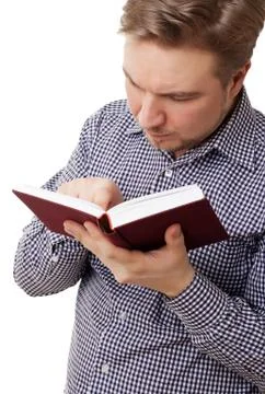 Young man reading a book Stock Photos