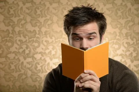 Young man reading book Foto stock