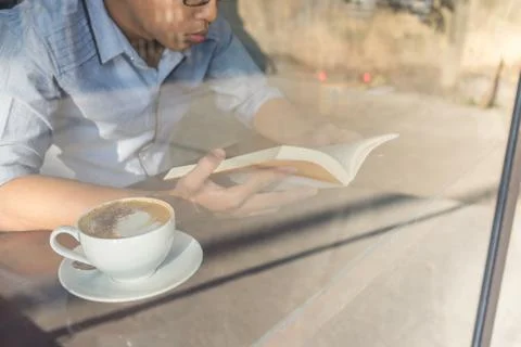 Young man reading book Stock Photos
