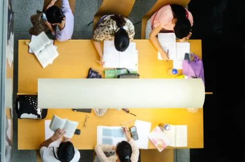 Young man reading in the library Stock Photos