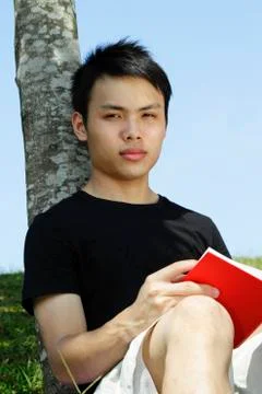 Young man reading Stock Photos