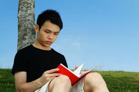 Young man reading Stock Photos