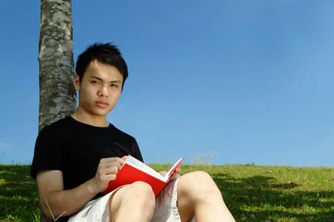 Young man reading Stock Photos