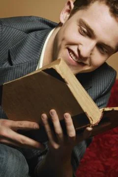 Young Man Reading Stock Photos