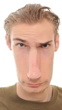 A young man with a really long distorted face isolated on white background Stock Photos