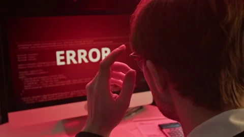 Young Man Receiving System Error Alert Message Working on Computer at Desk Stock Footage 331536157
