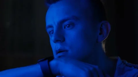 Young man recording voice message on smart watch at night in neon light, closeup Stock Footage 237476024