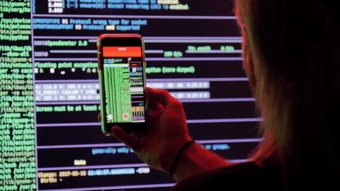 Young man records data streams onto a smart phone Stock Footage 118978086