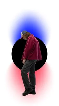 Young man in red jacket and cap standing against dark circle on white background Stock Photos