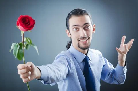 Young man with red rose Stock Photos