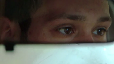 Young Man Reflection in Rear View Mirror Stock Footage 70266732