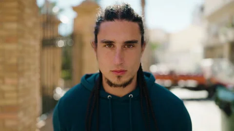 Young man with relaxed expression standing at street Video stock 172420150