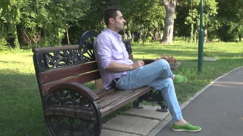 Young man  is relaxes in the park 스톡 동영상 25552448